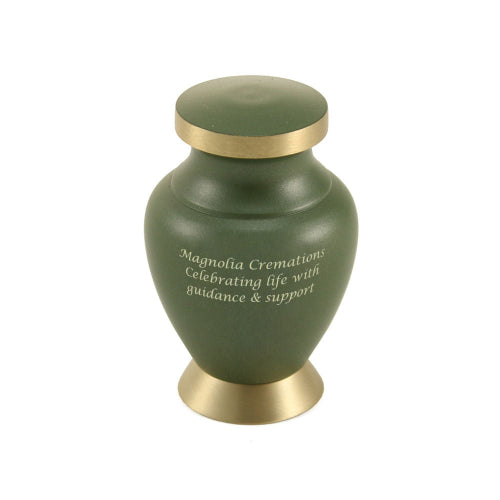 A close-up of the Aria Tree of Life Keepsake Urn from Magnolia Cremations, featuring a matte green finish, gold-tone trim, and an engraved inscription. This small urn is designed to hold a portion of ashes, offering a meaningful way to share a loved one’s memory among family members. Personalization options are available for a custom tribute.
