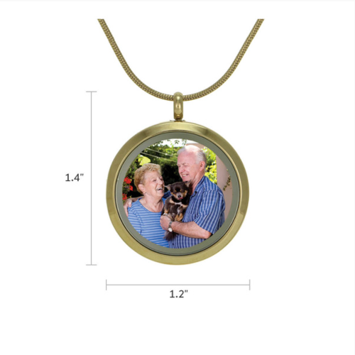 Bronze Round Butterflies Pendant Necklace, available at Magnolia Cremations, shown with dimensions (1.4" height x 1.2" width). Crafted in gold-tone stainless steel, the pendant features a hinged glass front for displaying a treasured photo. Engraving personalization available.