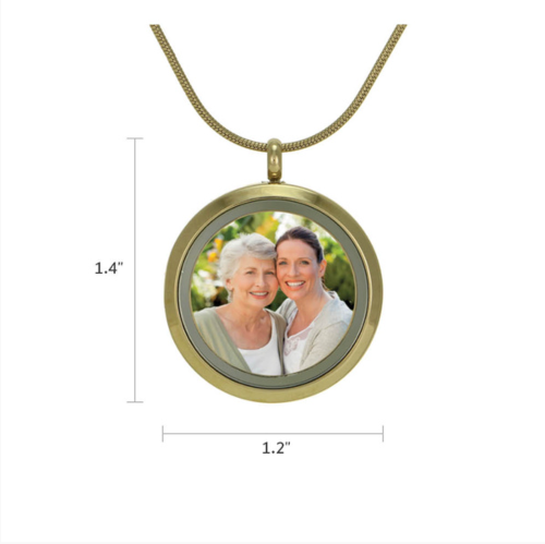 Bronze Round Photo Glass Pendant Necklace, available at Magnolia Cremations, shown with dimensions (1.4" height x 1.2" width). Crafted in gold-tone stainless steel, featuring a hinged glass front designed to showcase a cherished photograph, and securely holds ashes. Optional engraving available.