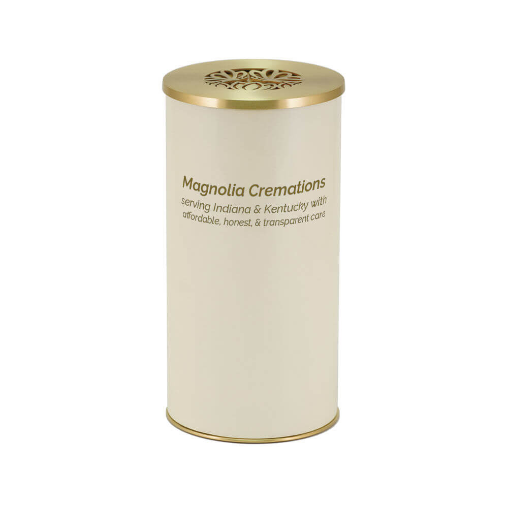 Cream-colored cylindrical scattering urn with a gold lid featuring a cut-out butterfly design. The front of the urn is printed with the text "Magnolia Cremations – serving Indiana & Kentucky with affordable, honest, & transparent care."