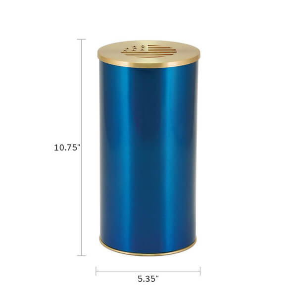 A blue cylindrical scattering urn with a gold-colored lid and base. The lid features a stylized cutout of the American flag with stars and stripes. The image includes measurements, showing the urn is 10.75 inches tall and 5.35 inches in diameter.