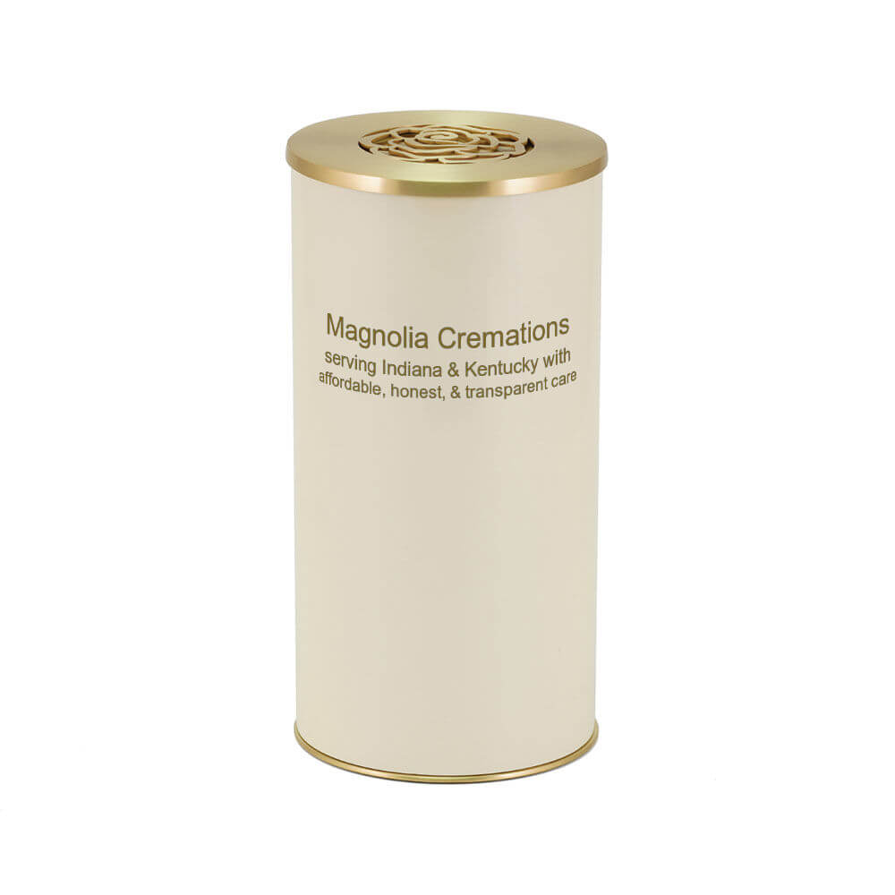 Cream-colored cylindrical scattering urn with a gold lid featuring a cutout rose design. The front of the urn is printed with the words “Magnolia Cremations – serving Indiana & Kentucky with affordable, honest, & transparent care.”