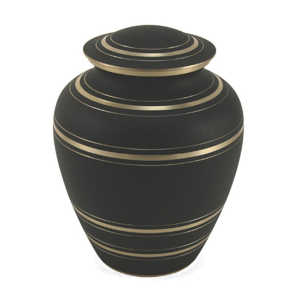A full-size memorial urn with a matte black finish and gold accent stripes. The urn has a traditional rounded shape with a domed lid, featuring multiple thin gold bands encircling both the body and lid, creating an elegant and timeless design.