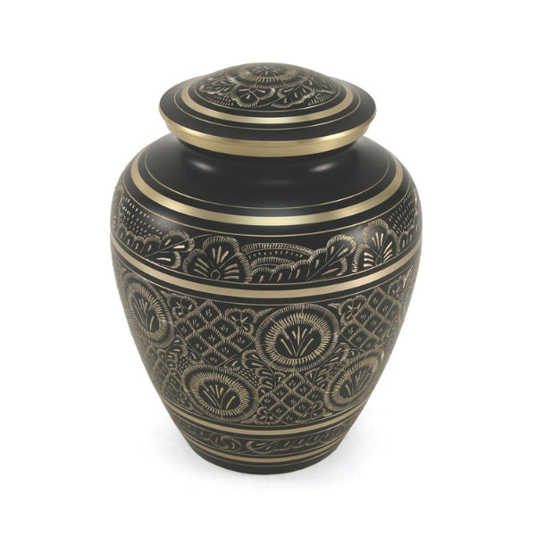 A traditional black and gold memorial urn with intricate hand-engraved patterns. The urn features floral and geometric designs with gold accents, along with matching gold bands on the lid and base. Engraving is not available for this urn.