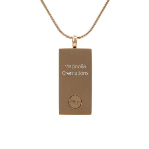 The Embossed Rose/Onyx Doves Memorial Necklace, available at Magnolia Cremations, features a rose gold-tone stainless steel pendant with a secure compartment for holding a small portion of ashes. The back of the pendant has a smooth, engravable surface and a discreet screw closure for easy access. This meaningful piece comes with a matching 19-inch chain and offers an engraving option for personalization.