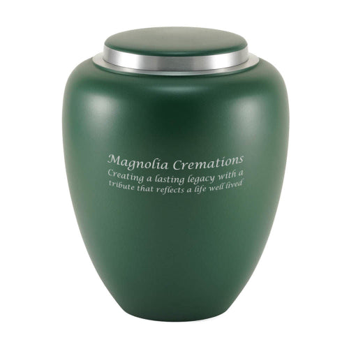 A sleek, emerald green memorial urn with a smooth matte finish and a contrasting silver lid. The urn features an engraving, highlighting the option for personalization.