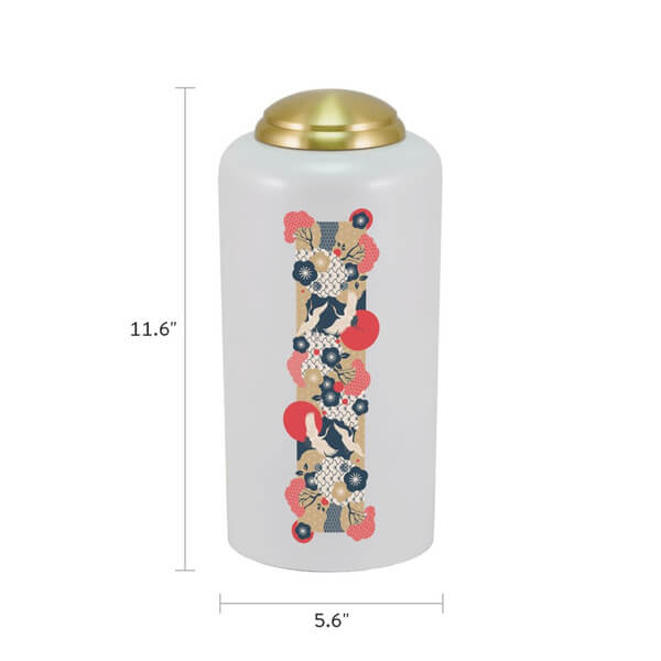 White cremation urn with a gold lid, featuring a vertical Japanese-style crane and floral design in red, navy blue, cream, and gold. The urn is shown with dimensions: 11.6 inches tall and 5.6 inches wide.