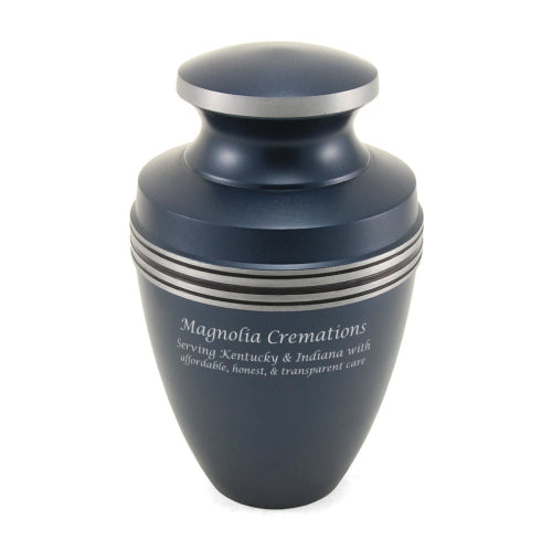 A matte blue urn with silver-tone accent bands around the upper portion and a matching silver rim on the lid. The urn features engraved text on the front, and engraving is available for personalization.