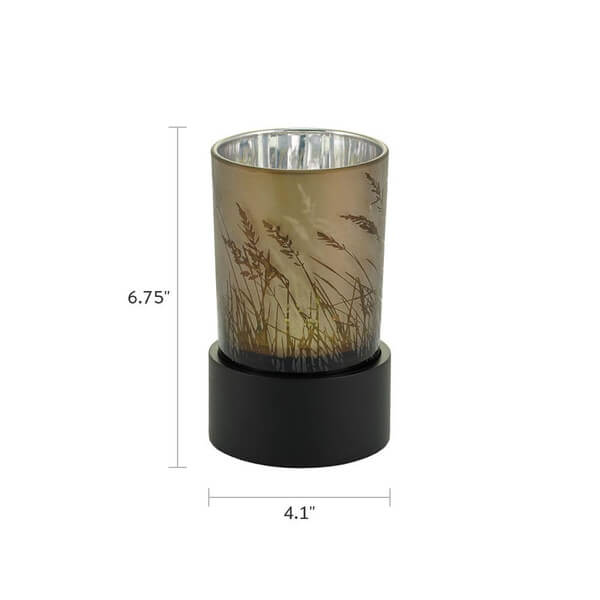 Keepsake urn that doubles as a tealight candle holder, with a frosted glass design of tall grasses and a black base. Dimensions are shown: 6.75 inches tall and 4.1 inches wide.
