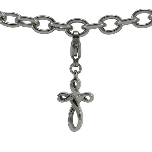 The Infinity Cross Keepsake Charm, available at Magnolia Cremations, is a silver-tone stainless steel charm featuring a graceful looping cross design. Designed to discreetly hold a small portion of ashes, this charm serves as a meaningful tribute to a loved one. The secure clasp allows for easy attachment to a bracelet or necklace.