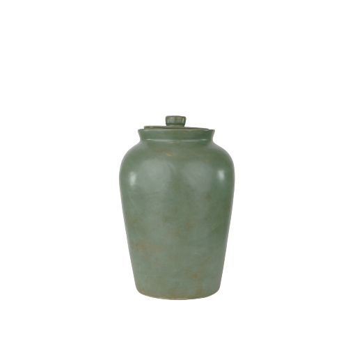 The Modern Classic Forest Memorial Urn by Stoneware & Co. is a handcrafted ceramic cremation urn in a rich forest green glaze. Its smooth, organic finish evokes a deep connection to nature, making it a meaningful tribute to a loved one. With a contemporary yet timeless design, this full-size urn offers a dignified resting place while complementing home décor. Available through Magnolia Cremations.