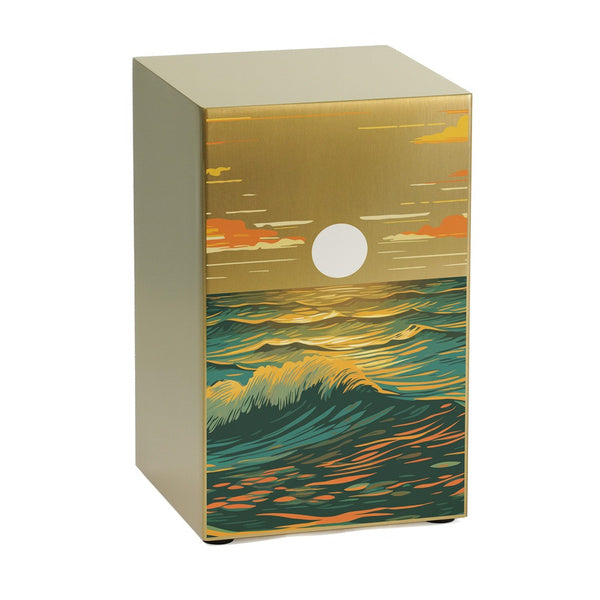 The Ocean Landscape in Bronze Memorial Urn features a brushed stainless steel finish with a rich, artistic seascape design. The front panel showcases a stylized ocean scene with rolling waves in deep blue and golden hues, reflecting the warm glow of a setting sun. Above, the sky is painted with soft clouds in shades of orange and gold, creating a tranquil and serene tribute. The urn’s modern, rectangular shape blends contemporary elegance with a deeply personal design, part of the Life Canvas Series.