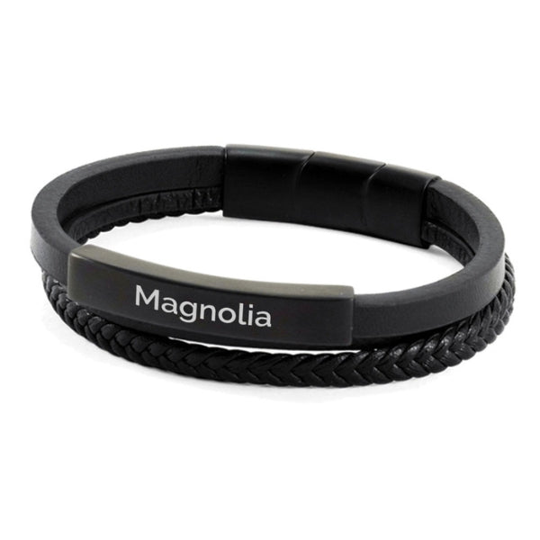 The Onyx/Black Dual Band Leather Bracelet, available at Magnolia Cremations, is a sleek and sophisticated memorial piece. Featuring a combination of smooth and braided leather bands, this bracelet offers a modern and versatile design. Crafted from stainless steel and genuine leather, it includes a discreet compartment for holding a small portion of ashes. Engraving is available for personalization, making it a meaningful way to honor a loved one.