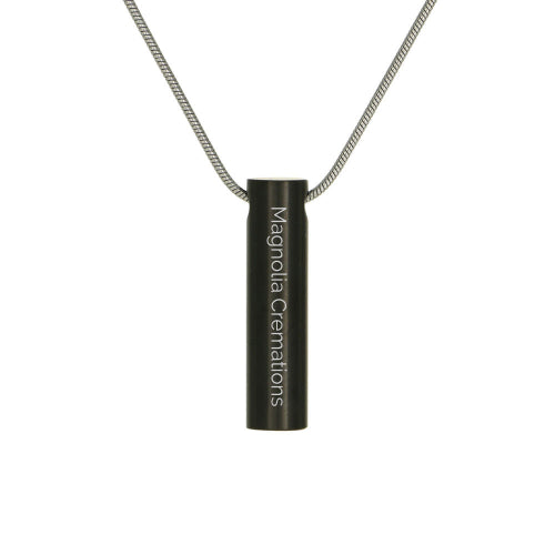 The Onyx Cylinder with Cubic Zirconia Memorial Necklace, available at Magnolia Cremations, is a sleek black stainless steel pendant with a modern cylindrical design. This piece features a single cubic zirconia accent and can be engraved for a personalized tribute. Designed to hold a small portion of ashes, the pendant offers a discreet and elegant way to keep a loved one close. It includes a matching chain for a complete and timeless look.