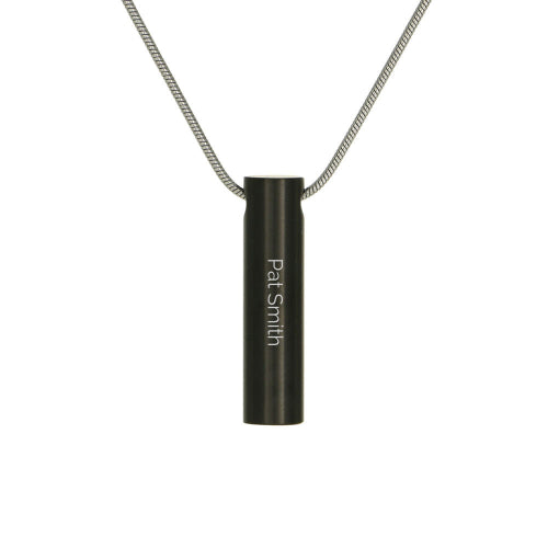 The Onyx Cylinder with Cubic Zirconia Memorial Necklace, available at Magnolia Cremations, is a sleek black stainless steel pendant with a modern cylindrical design. It features a single cubic zirconia accent and an engraving option for personalization. Designed to hold a small portion of ashes, this piece offers a discreet and elegant way to keep a loved one close. The pendant includes a matching chain for a timeless and sophisticated look.