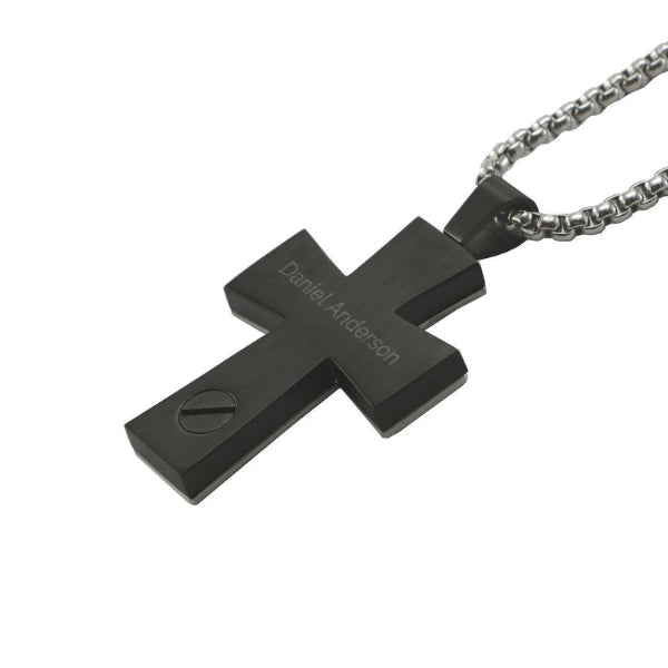 The Onyx Textured Cross and Chain, available at Magnolia Cremations, is a bold, stainless steel pendant with a black finish, featuring a subtle engraved name on the back. It includes a discreet screw compartment for holding a small portion of ashes. The pendant comes with a sturdy silver chain, making it a meaningful and stylish keepsake.
