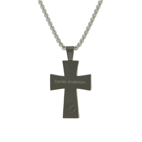The Onyx Textured Cross and Chain, available at Magnolia Cremations, is a bold stainless steel pendant with a dark, polished finish. It features a subtle engraved name on the back and a discreet screw compartment at the bottom for holding a small portion of ashes. The pendant is paired with a sturdy silver chain, making it a meaningful and stylish memorial piece.