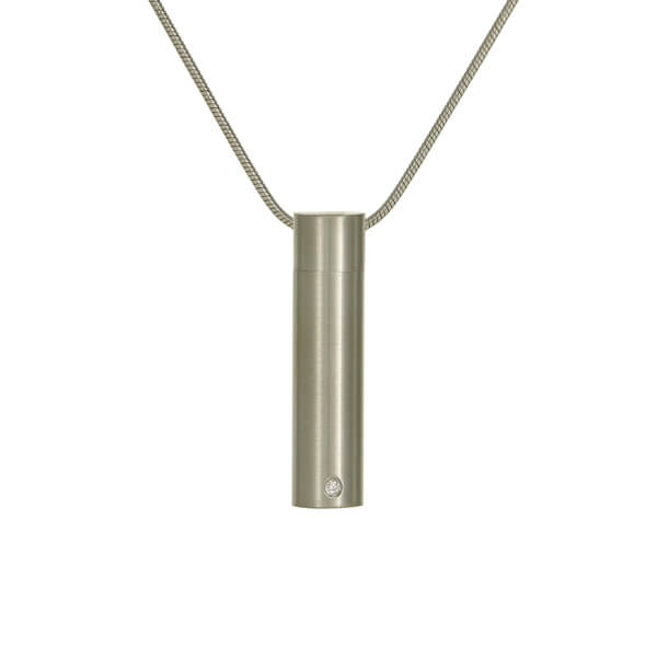 The Pewter Cylinder w/ Cubic Zirconia Necklace, available at Magnolia Cremations, is a sleek stainless steel memorial pendant with a brushed silver finish. Featuring a modern cylindrical design, this discreet keepsake holds a nominal amount of ashes and includes a small cubic zirconia accent for an elegant touch. Engraving is available to personalize this timeless tribute, which comes with a matching chain for daily remembrance.