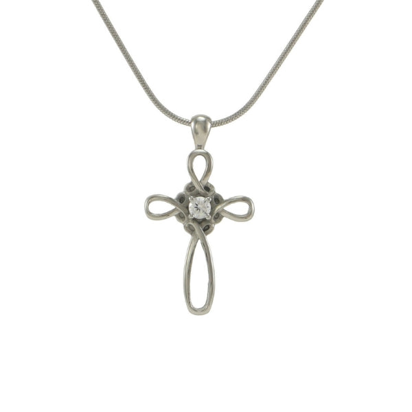 The Pewter Infinity Cross Memorial Necklace, available at Magnolia Cremations, is a delicate stainless steel pendant featuring an elegant infinity cross design with a sparkling cubic zirconia center. This timeless piece discreetly holds a nominal amount of ashes, offering a meaningful way to honor a loved one’s memory. It comes with a matching 19-inch chain.