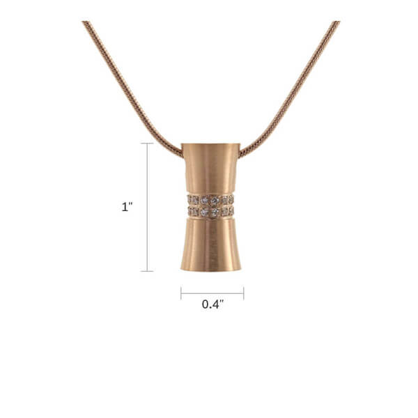 The Rose Hourglass Memorial Necklace, available at Magnolia Cremations, is elegantly designed with a rose gold finish and shimmering cubic zirconia accents. Measuring 1 inch in height and 0.4 inches in width, this stainless steel pendant is a sophisticated keepsake designed to hold a nominal amount of ashes. The hourglass shape symbolizes the preciousness of time and cherished memories. This pendant includes a matching 19-inch chain with a lobster claw clasp for secure wear.