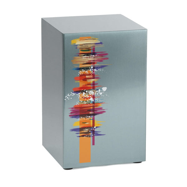 The Artist in Pewter Memorial Urn, available at Magnolia Cremations, is a contemporary stainless steel urn with a brushed pewter finish. Its striking abstract design features vibrant brushstrokes in red, orange, purple, and blue, accented by white splashes for a dynamic artistic effect. The urn offers personalization through engraving, creating a meaningful and unique tribute.
