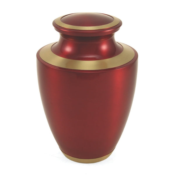The Trinity Crimson Memorial Urn, available at Magnolia Cremations. This full-size brass urn features a striking crimson high-gloss finish, accented with elegant gold bands along the lid, neck, and base, creating a timeless and dignified tribute.