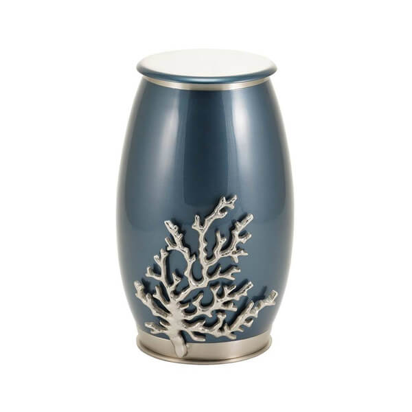 The Windsong Coral Memorial Urn, available at Magnolia Cremations. This elegant urn features a deep ocean-blue high-gloss finish, evoking the tranquility of the sea. A sculpted silver coral accent extends from the base, adding texture and dimension. The urn is crafted from durable stainless steel with subtle brass accents, blending contemporary style with natural inspiration. Personalization is available for a customized tribute.
