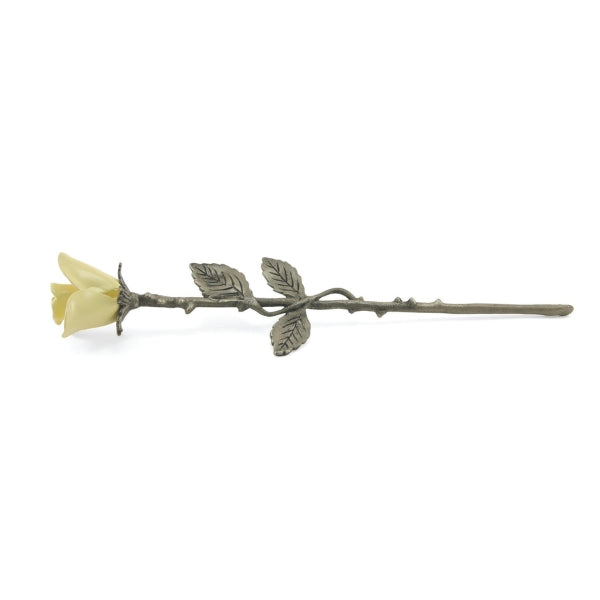 The Yellow Rose Keepsake from Magnolia Cremations is a finely crafted brass memorial piece featuring a soft yellow rose with a pewter-finished stem adorned with detailed leaves. Designed to hold a small portion of ashes, this timeless tribute serves as a meaningful way to honor a loved one while blending seamlessly with any décor.