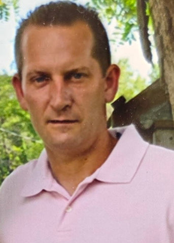 C. Adam Boettger