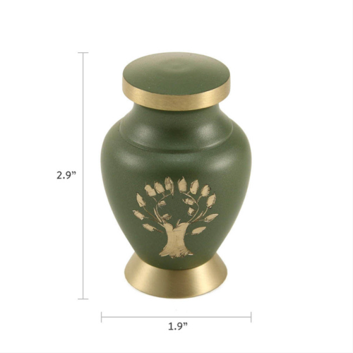 The Aria Tree of Life Keepsake Urn, available at Magnolia Cremations, is shown with dimensions of 2.9 inches in height and 1.9 inches in width. This small brass urn features a matte green finish with a gold-tone engraved tree design, symbolizing life and legacy. Designed to hold a token amount of ashes, it provides a meaningful way for family members to share and cherish a loved one’s memory.