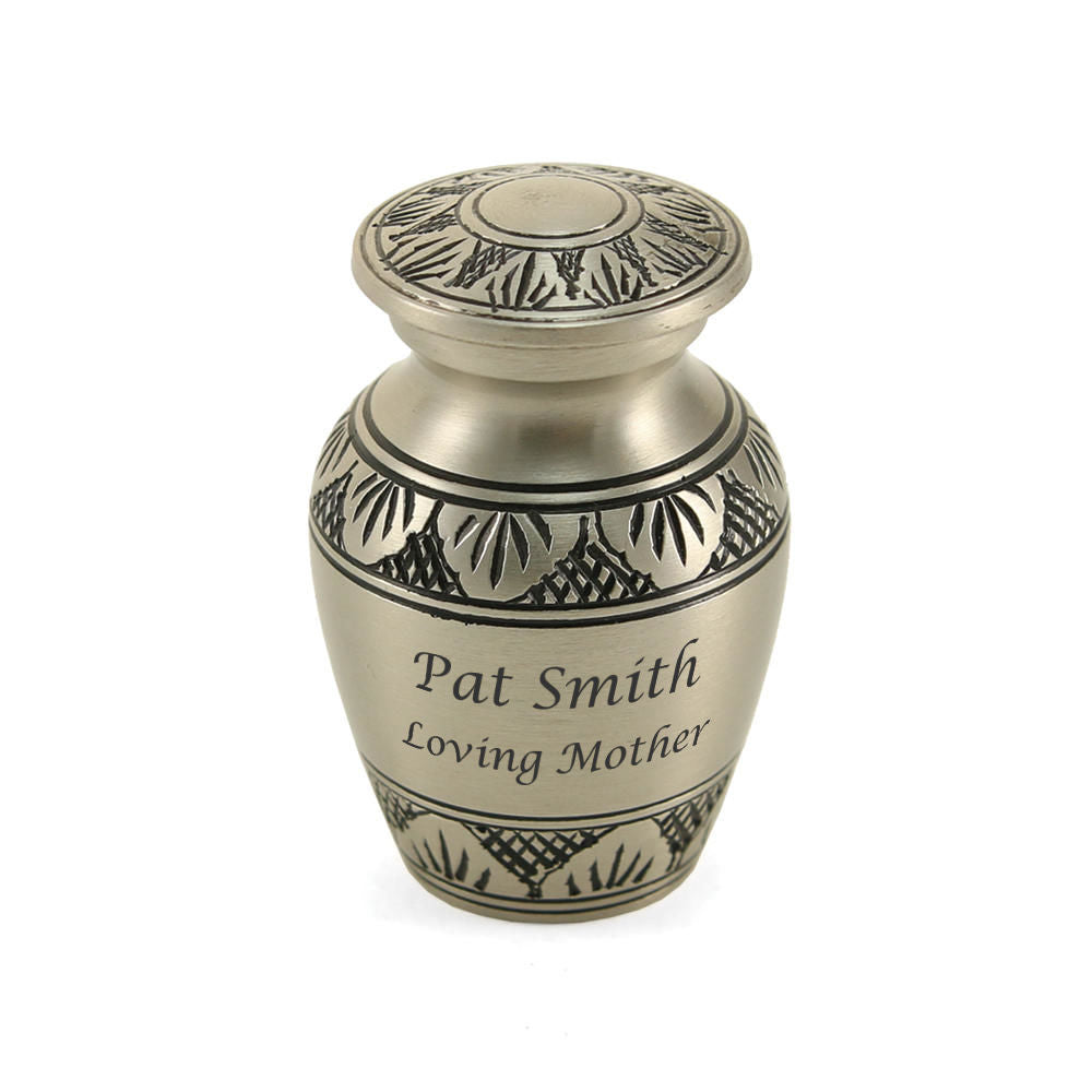 Athena® Pewter Keepsake urn. This small urn features a classic shape with a hand-brushed pewter finish and delicate Grecian-style leaves. Made from solid brass with a secure, threaded lid, it is ideal for keeping a small portion of ashes.