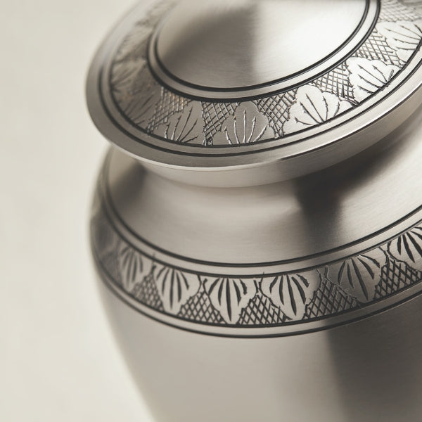 Athena Pewter cremation urn with a pewter finish and decorative bands.