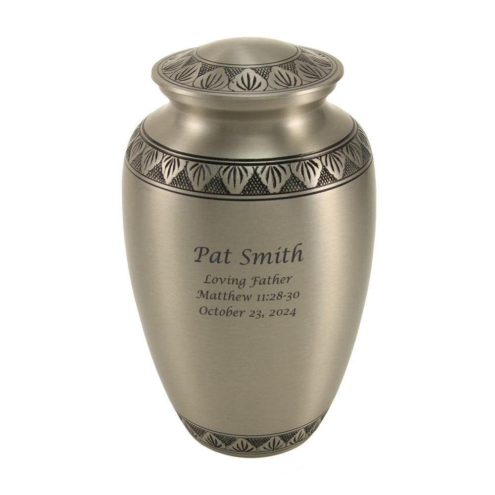 Athena Pewter Memorial Urn. This full-size urn features a classic shape with a hand-brushed pewter finish and delicate Grecian-style leaves. Made from solid brass with a secure, threaded lid, it is suitable for holding the ashes of an adult.