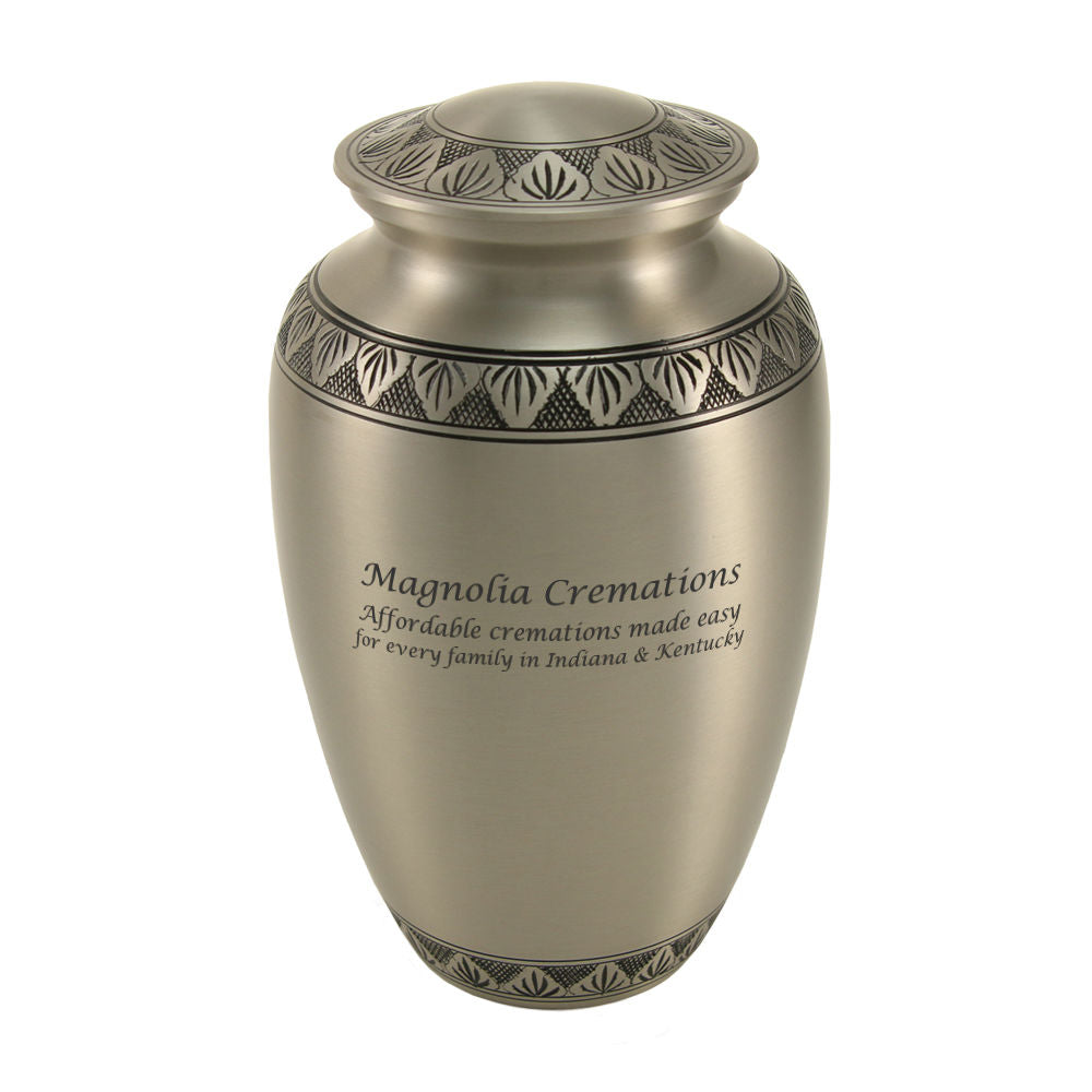 Classic urn in pewter with an engraved band of leaves.