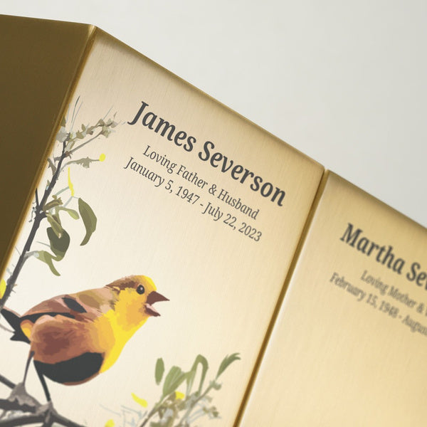 Close-up of a Life Canvas Birds Bronze cremation urn with custom-engraved name and dates.