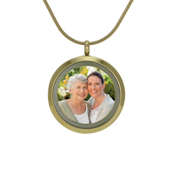 Bronze round hinged cremation pendant. This unique piece of jewelry features a hinged glass front for displaying a photo and a compartment on the back for holding a small amount of ashes. A beautiful way to keep a loved one close.