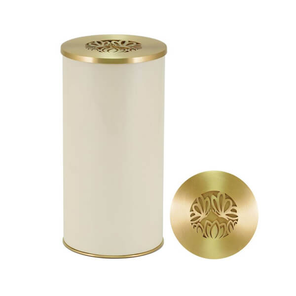 A cylindrical scattering urn with a smooth cream-colored body and a metallic gold lid. The lid features a decorative cut-out design of butterflies, shown both on the urn and separately beside it.