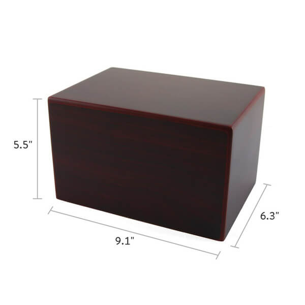 A cherry-colored wooden rectangular cremation urn with smooth, glossy surfaces, shown with dimensions labeled: 9.1 inches wide, 5.5 inches tall, and 6.3 inches deep.