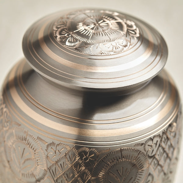 Classic Platinum urn with its lid, showcasing the smooth platinum finish and classic design.