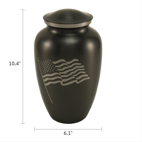 Classic Flag Full-Size Cremation Urn with dimensions displayed. The urn measures 10.4 inches in height and 6.1 inches in width. Made of black stainless steel, it features a silver engraving of the American flag. Designed to honor a patriot, this urn can be personalized with custom engraving. 200 cubic inch capacity.