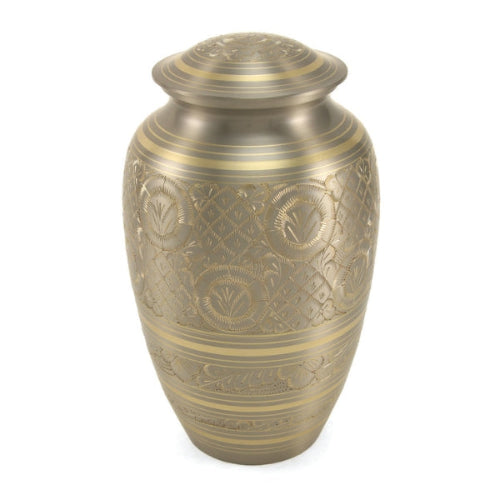 Classic Platinum Full-Size Cremation Urn. A traditional brass urn with a silver finish, featuring intricate hand-engraved floral and geometric patterns. The elegant design is accented with gold detailing, making it a timeless memorial piece. 190 cubic inch capacity.