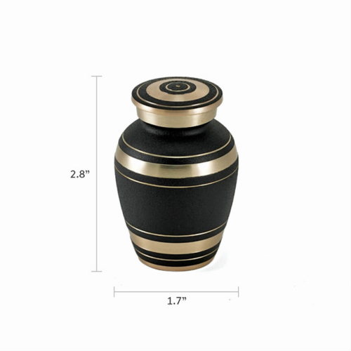 The Elite Onyx Keepsake Urn, available at Magnolia Cremations, is a small, elegant urn featuring a textured matte black finish accented by gold-tone bands. Measuring 2.8 inches in height and 1.7 inches in width, this compact urn is designed to hold a token amount of ashes, making it ideal for sharing a loved one's memory among family members. The urn's timeless design offers a dignified and lasting tribute.