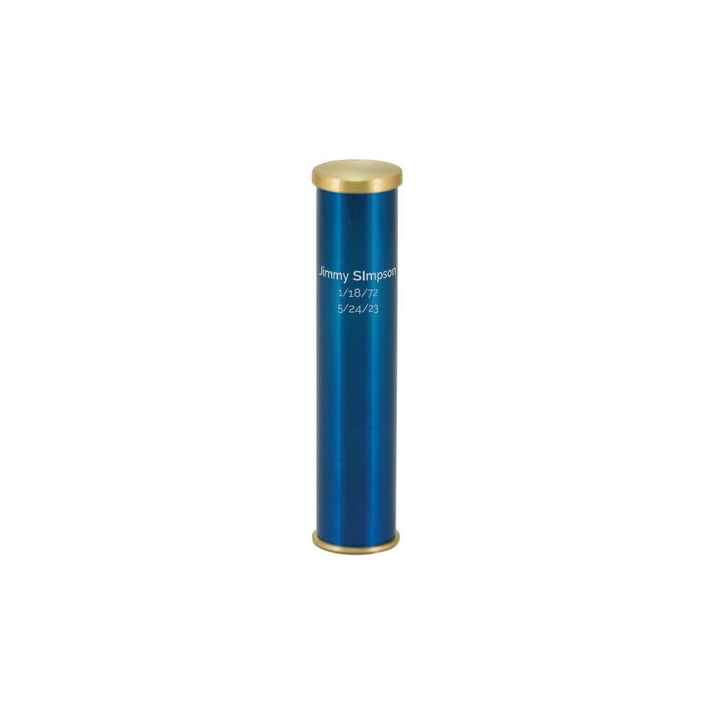 A tall, cylindrical scattering urn with a metallic blue body and gold-colored top and bottom caps. The urn is engraved with the name "Jimmy Simpson" along with the dates "1/18/72" and "5/24/23."