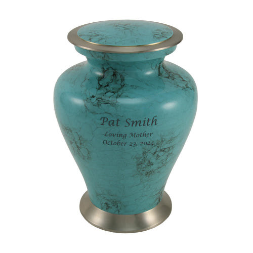 A teal blue marble-patterned urn with silver-tone accents on the lid and base. The urn has a glossy finish with black veining and features engraved text on the front, which is available for personalization.