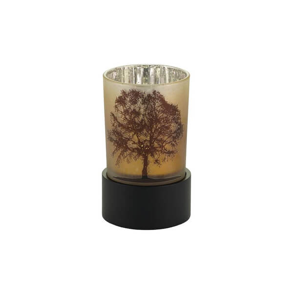 Keepsake urn that also functions as a tealight candle holder, featuring a frosted glass cup with a detailed tree silhouette design and a black circular base.