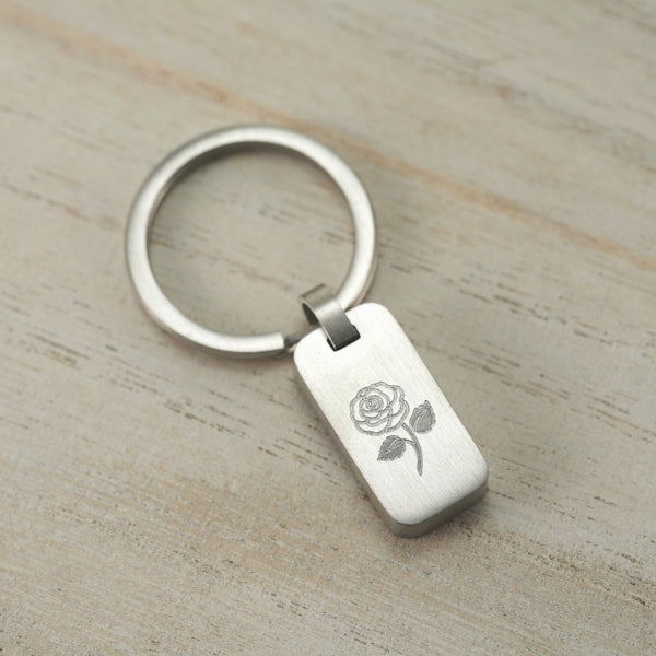 Stainless steel keychain with a rose design, symbolizing love and remembrance.