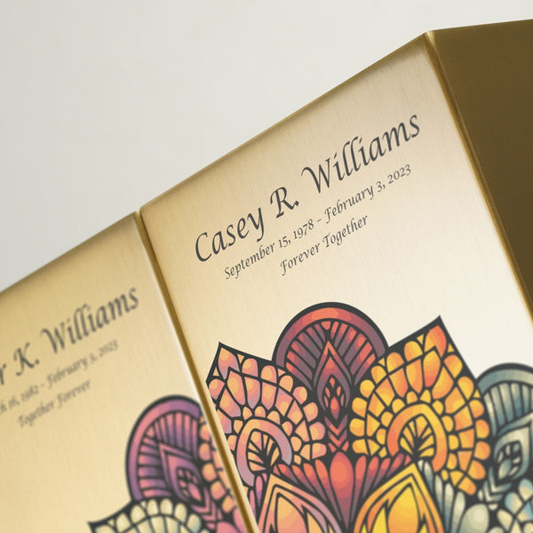 Close-up of the Mandala in Bronze Companion Urns by Magnolia Cremations, highlighting the elegant engraving and intricate mandala design. The brushed bronze surface complements the vibrant, symmetrical pattern, creating a meaningful tribute for loved ones. These contemporary urns can be displayed individually or as a set, with personalized engraving available.