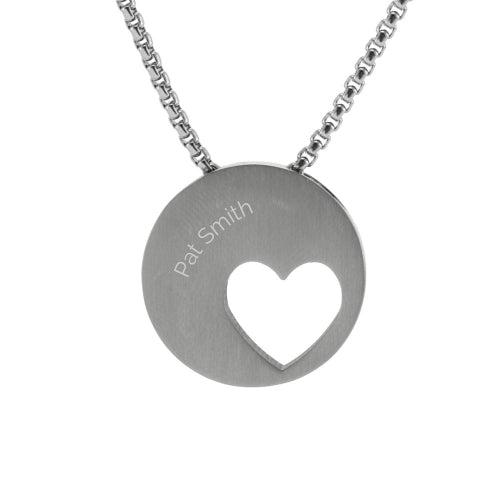 The Pewter Eternity Heart Memorial Necklace, available at Magnolia Cremations, is a stainless steel pendant with a circular design and an off-centered heart cutout, symbolizing everlasting love and remembrance. This memorial keepsake discreetly holds a nominal amount of ashes and includes a 21-inch chain for a timeless tribute. The image showcases the optional engraving feature, allowing for personalization to honor a loved one.