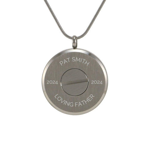 The Pewter Round Circles Pendant Necklace, available at Magnolia Cremations, is shown from the back, highlighting the engraving option for a personalized memorial. This stainless steel cremation pendant securely holds a small portion of ashes, offering a meaningful keepsake. It features a screw closure for added security and includes a matching 19-inch chain.