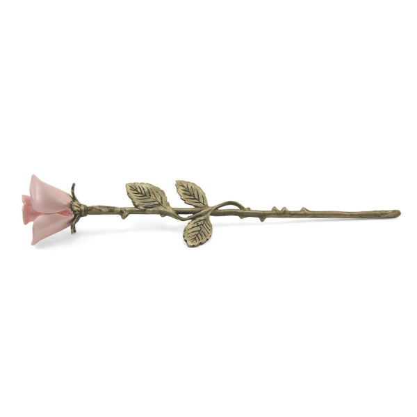 The Pink Rose Keepsake from Magnolia Cremations is a delicate brass memorial piece featuring a soft pink rose with a gold-toned stem and intricately detailed leaves. Designed to hold a small portion of ashes, this elegant keepsake serves as a heartfelt tribute to a cherished loved one.